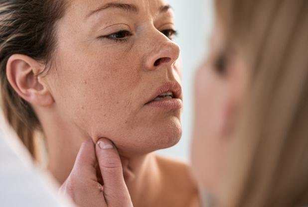 Woman experiencing skin laxity in Beaconsfield due to ageing around the lower face